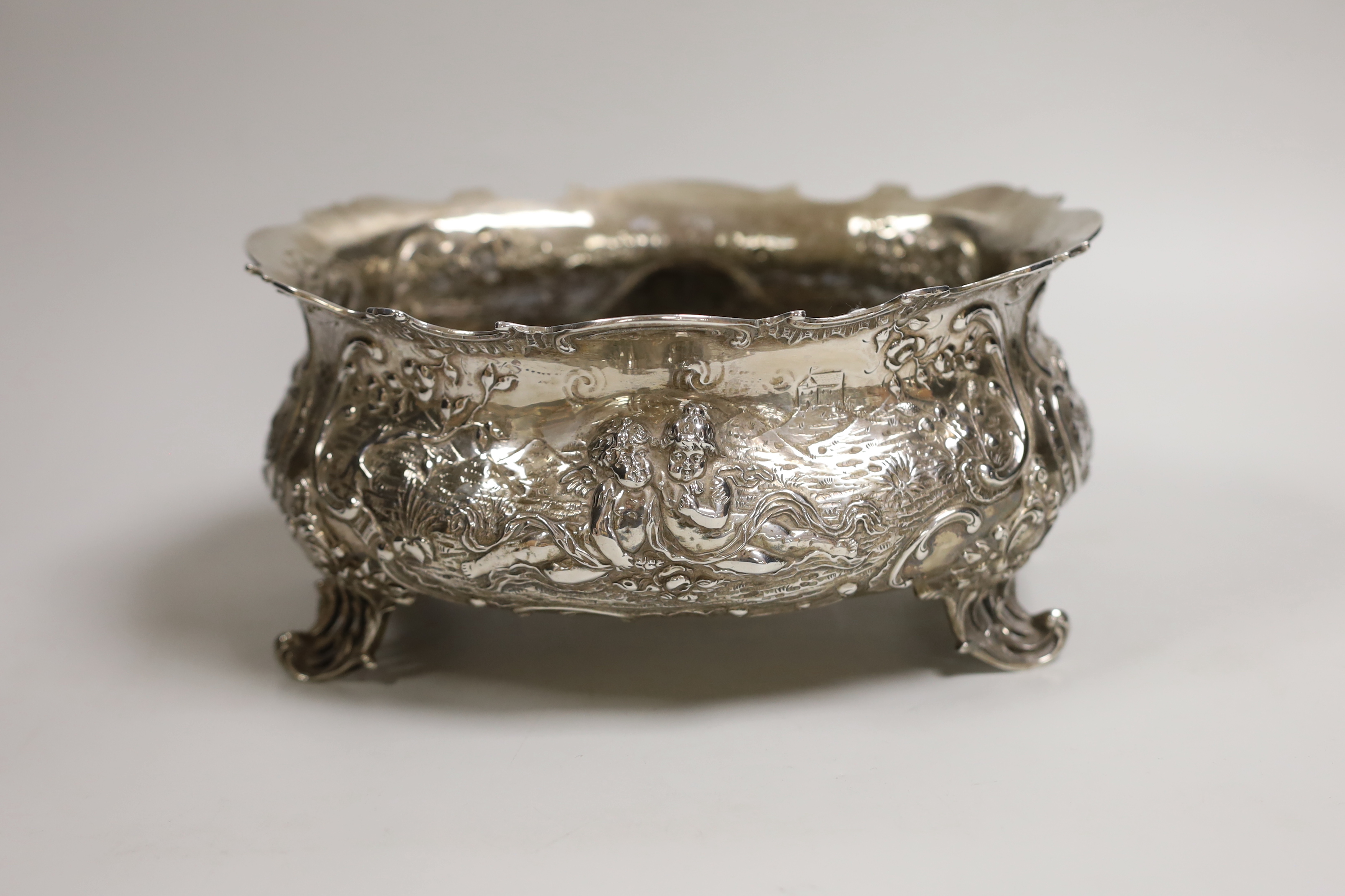 An ornate late 19th century German embossed silver oval fruit bowl, with pierced scroll feet, import marks for London, 1890, length 23.9cm, 30oz.